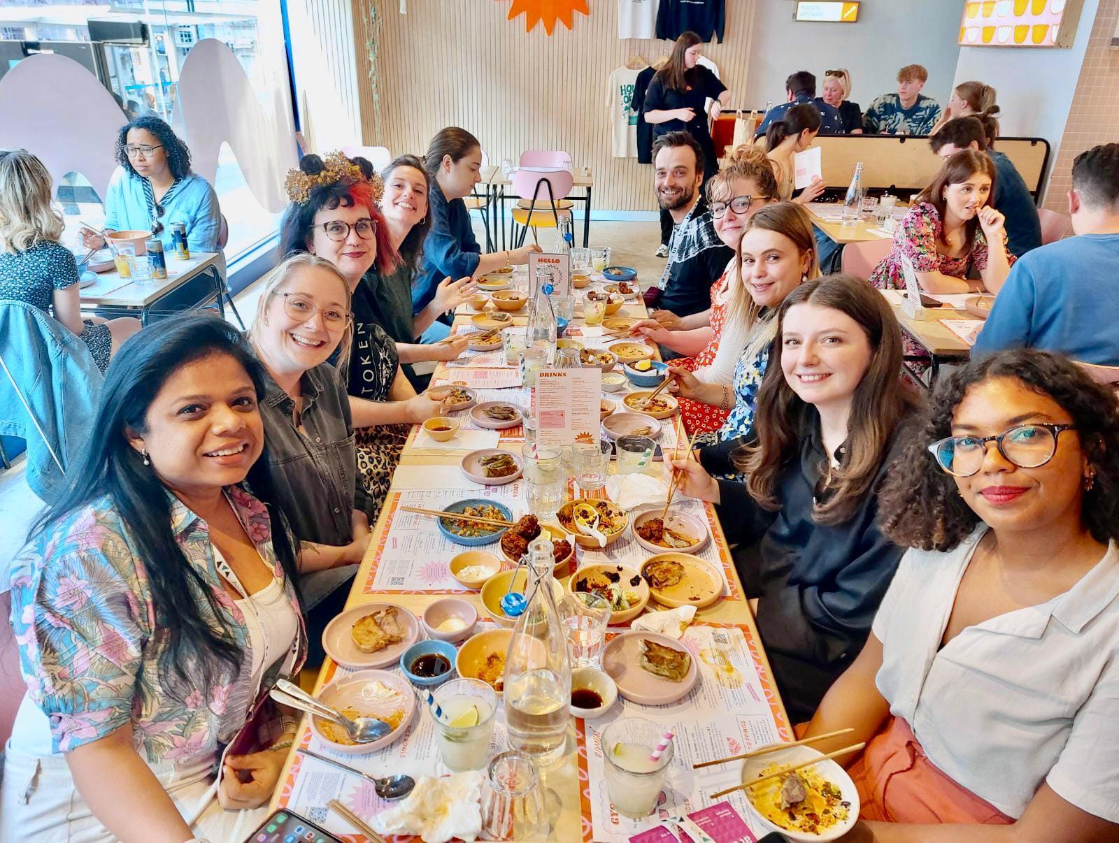 Sherin with 9 other AMA Conference delegates sat round a rectangle table with food on, at AMA's Thursday night Destination Dinners.